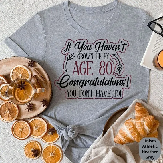 If You Haven't Grown Up By 80, Congrats You Don't Have To! Celebrate a Lifetime of Memories with Our Funny 80th Birthday Shirt